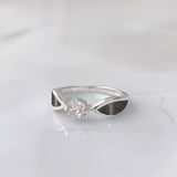 Silver ring · Solitaire with cubic zirconia and sides with sand or earth