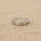 Ring with sand · Crossed silver band with sand or earth