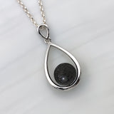Pendant with sand · Silver and pearl drop or teardrop with sand or earth