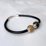 Charm Arena · Silver charms and double sphere of sand or earth