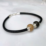 Charm Arena · Silver charms and double sphere of sand or earth